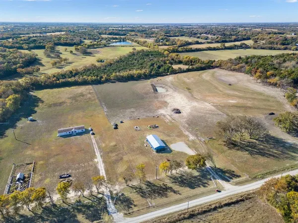 a kitchen with stainless steel appliances granite countertop a refrigerator stove a sink dishwasher and microwave with cabinets