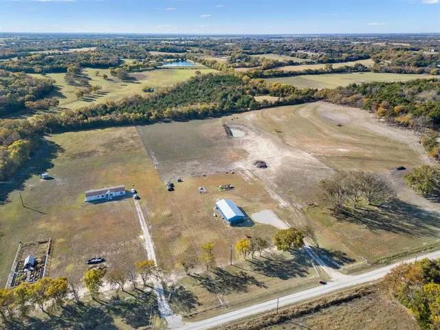 a kitchen with stainless steel appliances granite countertop a refrigerator stove a sink dishwasher and microwave with cabinets