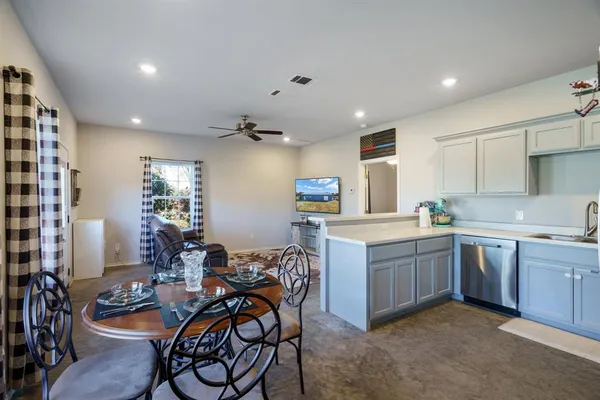 a view of a dining room with furniture window and outside view