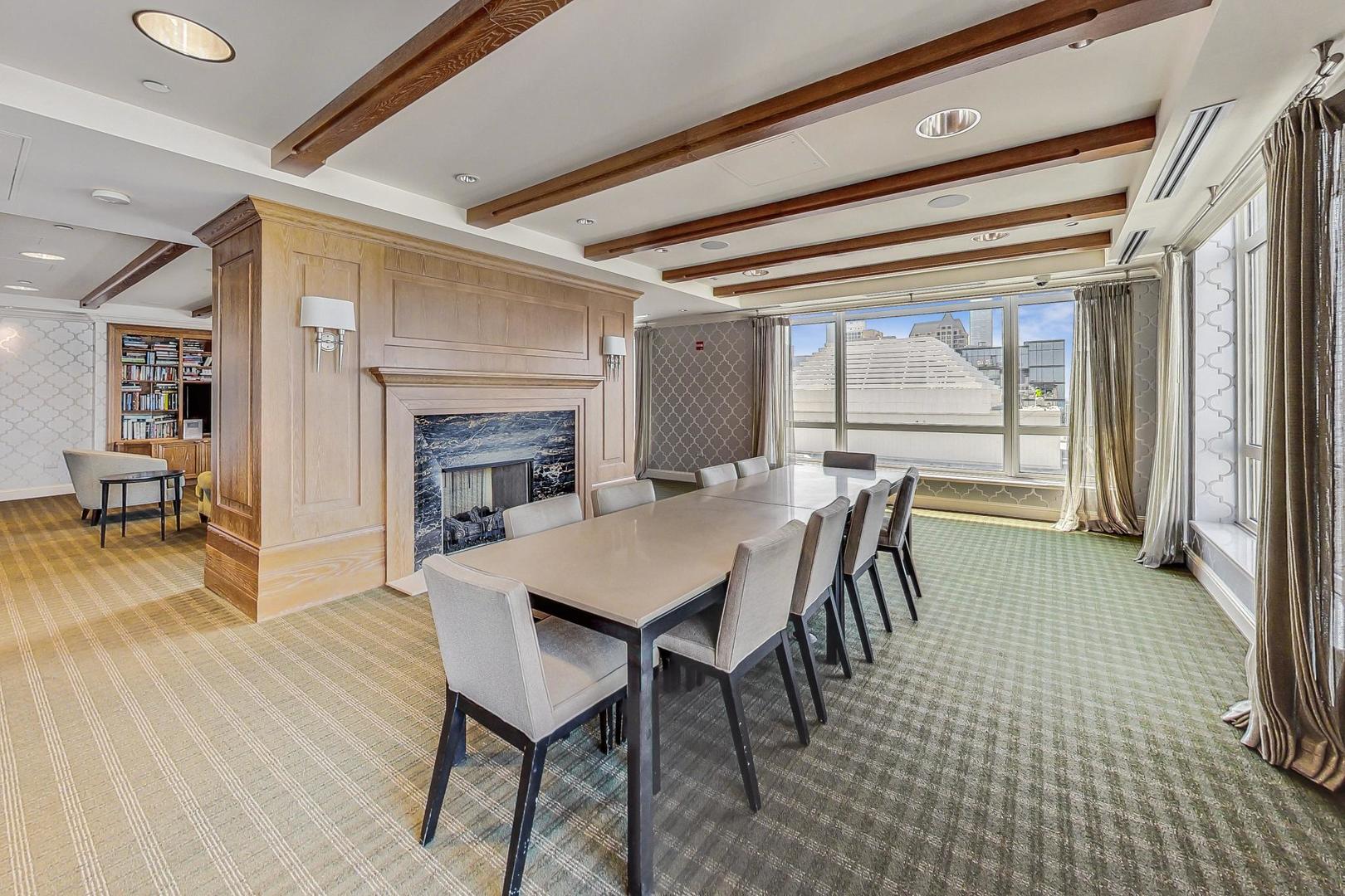 10 East Delaware Place, Unit 20A Chicago, IL 60611 - Photo 31 of 42 a dining room with furniture and wooden floor