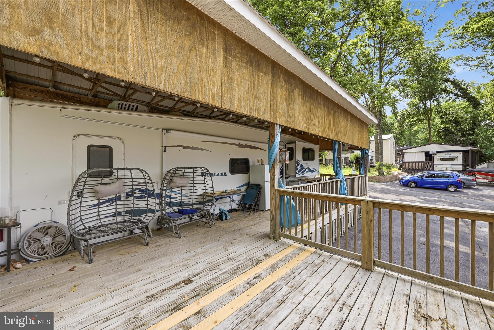 Lot 20 Hot Dog Road Falling Waters, WV 25419 - Photo 13 of 26 a view of a house with wooden deck and furniture