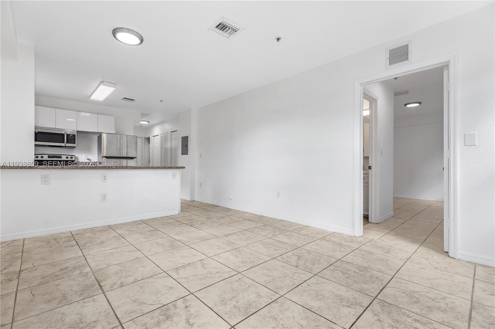 520 Southwest 5th Street, Unit 303 Miami, FL 33130 - Photo 12 of 20 a view of a kitchen with microwave and cabinets