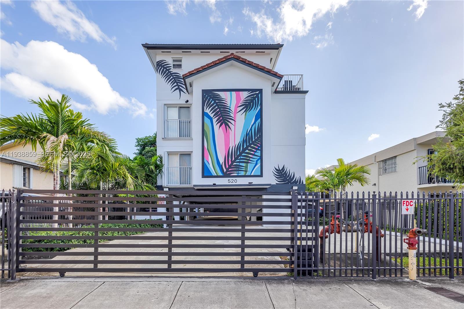 520 Southwest 5th Street, Unit 303 Miami, FL 33130 - Photo 20 of 20 a front view of a house with a garden