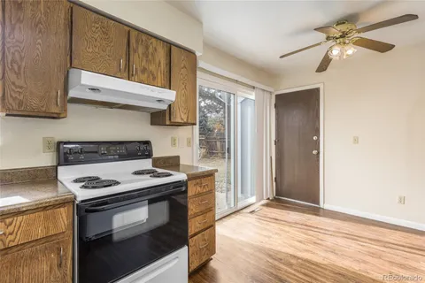 a kitchen with stainless steel appliances granite countertop a stove and a refrigerator