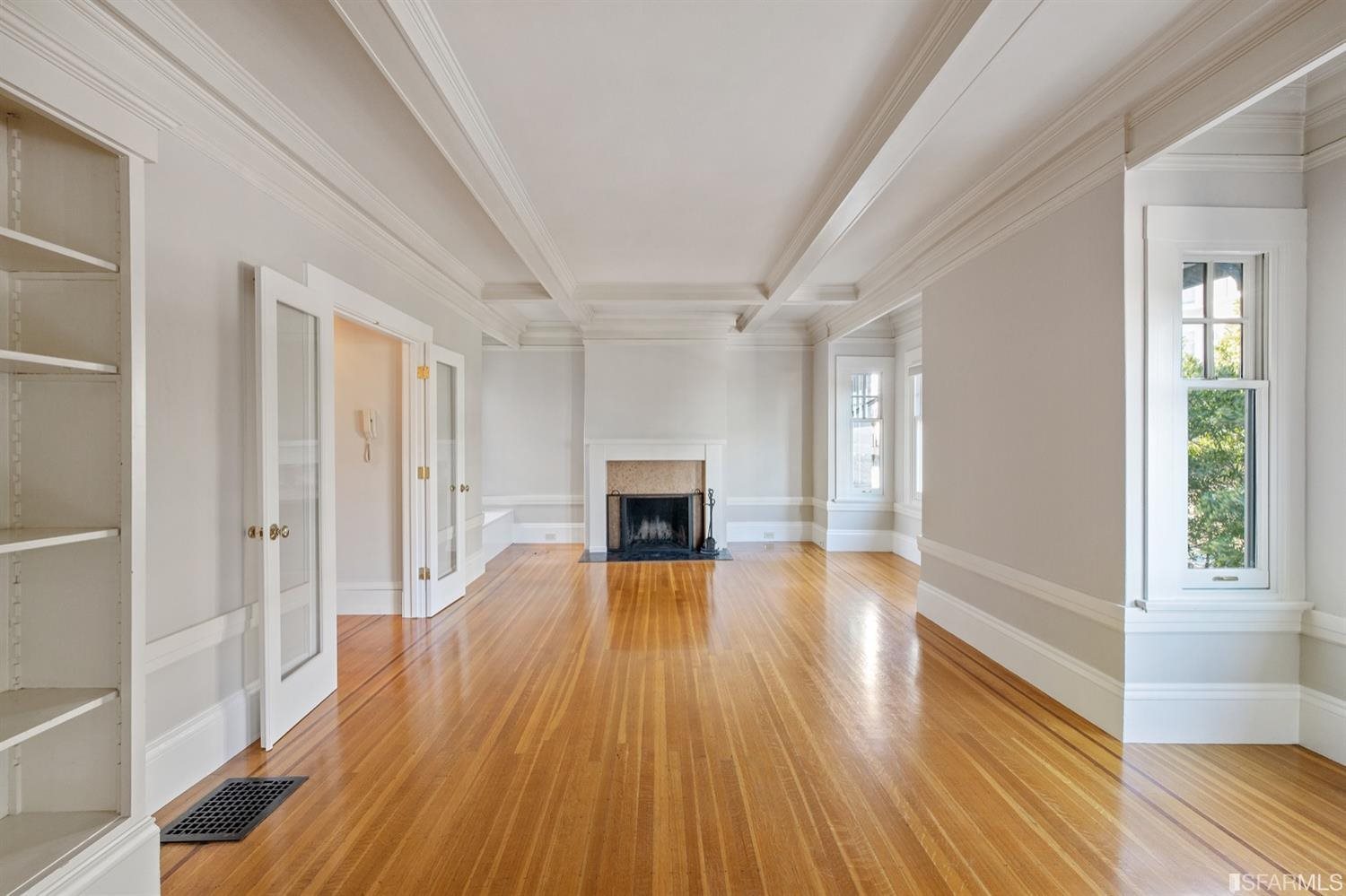 1069 Broadway San Francisco, CA 94133 - Photo 15 of 43 wooden floor fireplace and windows in an empty room