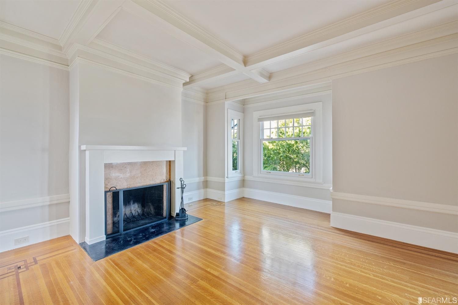 1069 Broadway San Francisco, CA 94133 - Photo 22 of 43 a view of an empty room with window and fire place