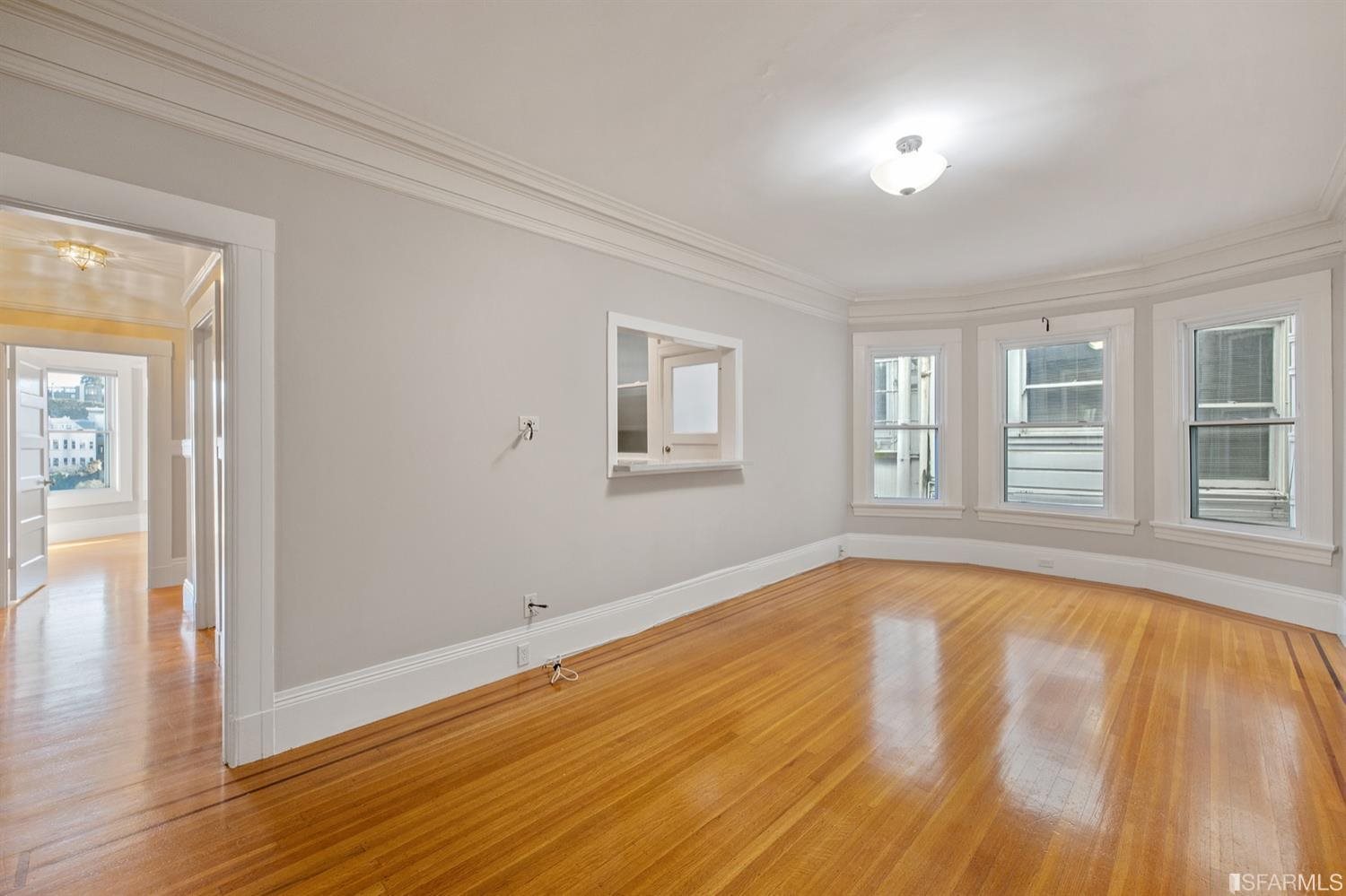 1069 Broadway San Francisco, CA 94133 - Photo 26 of 43 a view of empty room with wooden floor and fan