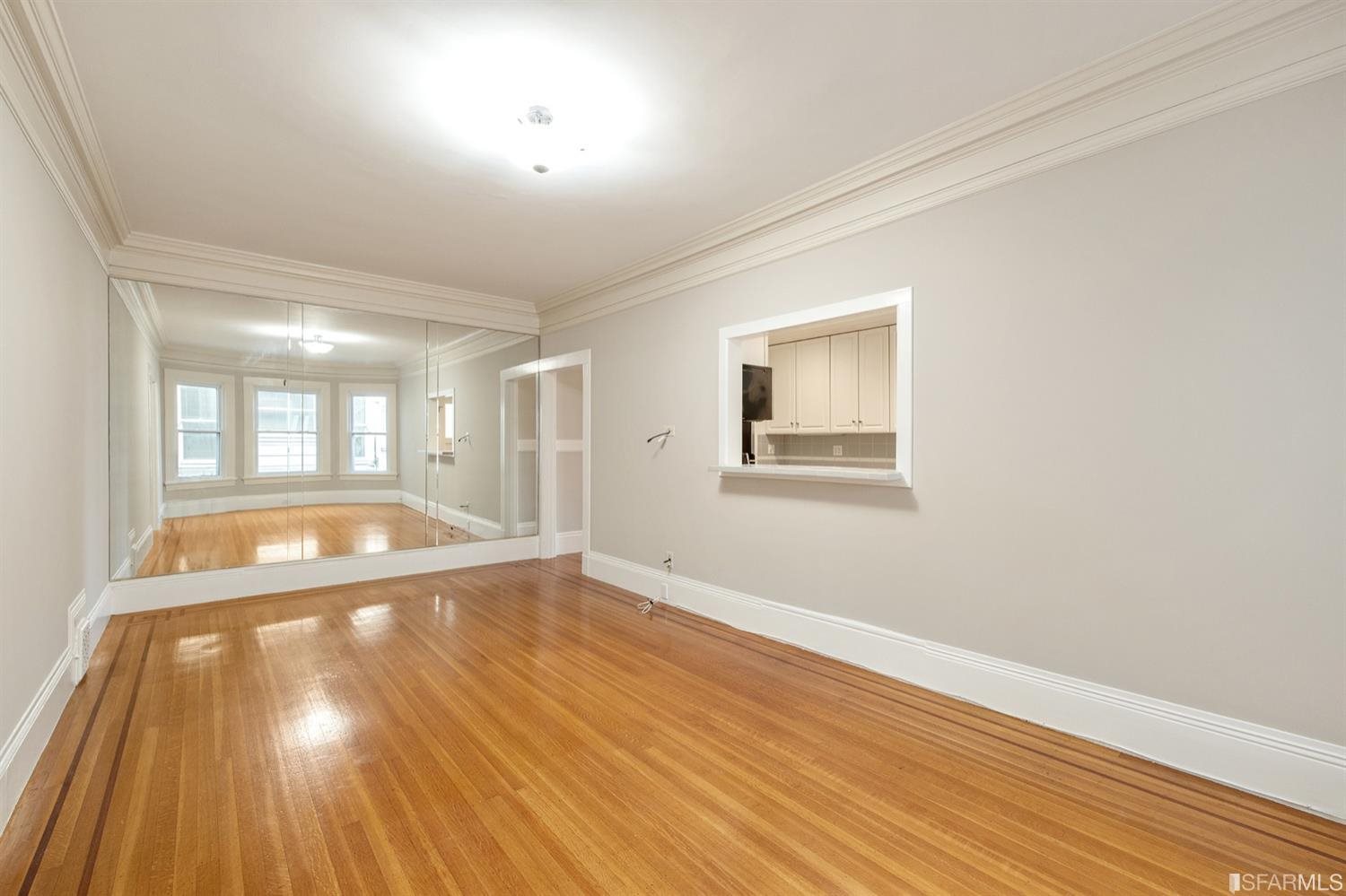 1069 Broadway San Francisco, CA 94133 - Photo 28 of 43 a view of a livingroom with wooden floor and a large window