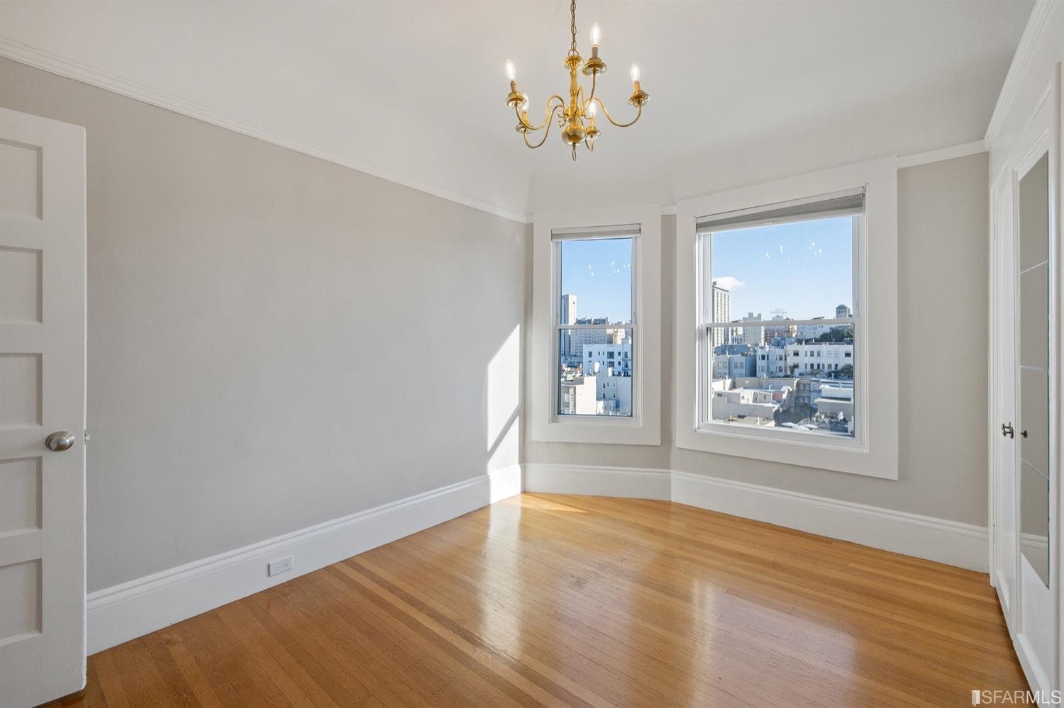 1069 Broadway San Francisco, CA 94133 - Photo 32 of 43 an empty room with wooden floor and window