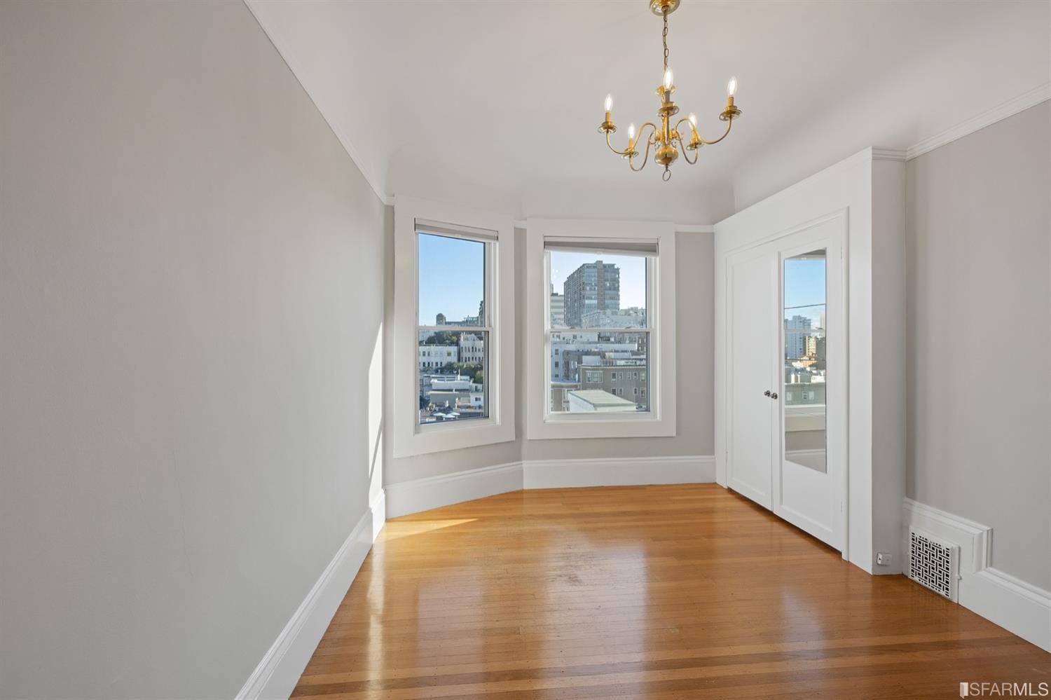 1069 Broadway San Francisco, CA 94133 - Photo 33 of 43 wooden floor in an empty room with a window