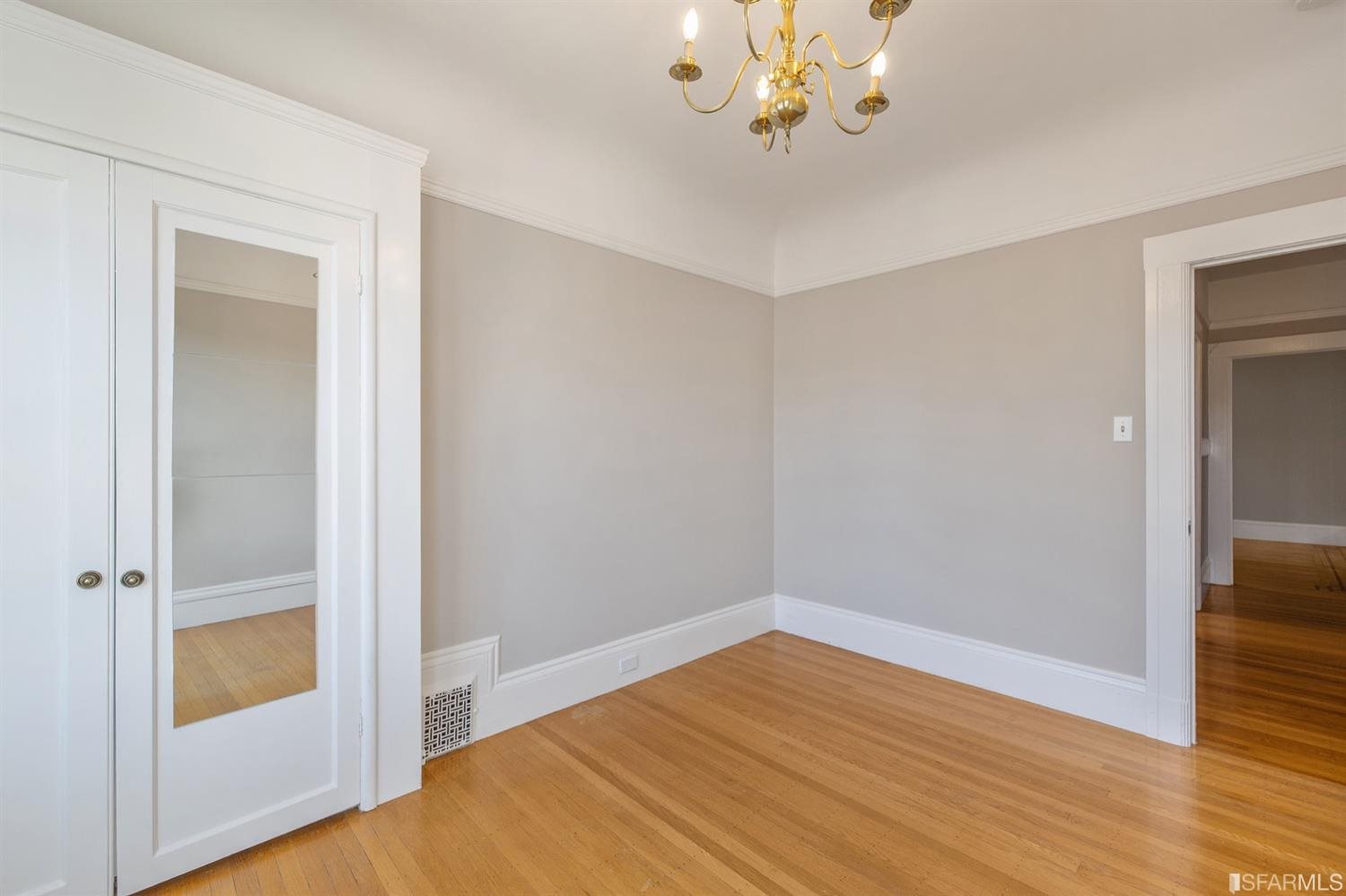 1069 Broadway San Francisco, CA 94133 - Photo 35 of 43 wooden floor in an empty room with a window