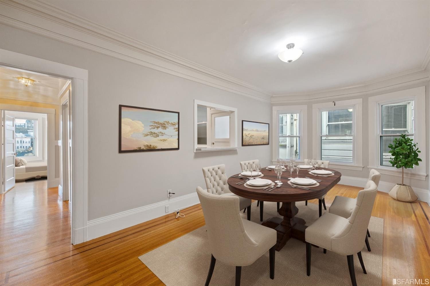 1069 Broadway San Francisco, CA 94133 - Photo 4 of 43 a view of a dining room with furniture and wooden floor