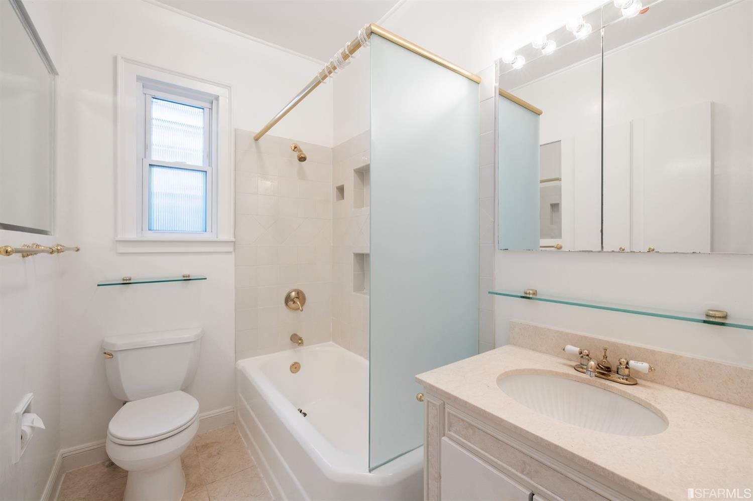 1069 Broadway San Francisco, CA 94133 - Photo 8 of 43 a bathroom with a sink toilet and shower