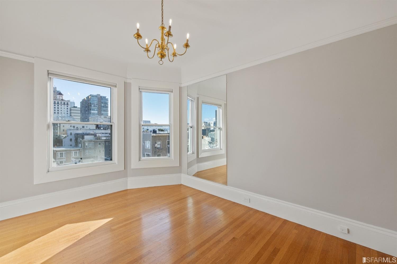 1069 Broadway San Francisco, CA 94133 - Photo 9 of 43 a view of empty room with wooden floor and fan