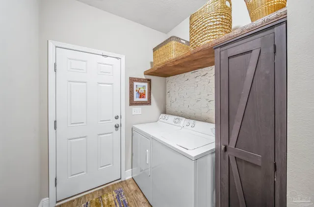 a utility room with dryer and washer