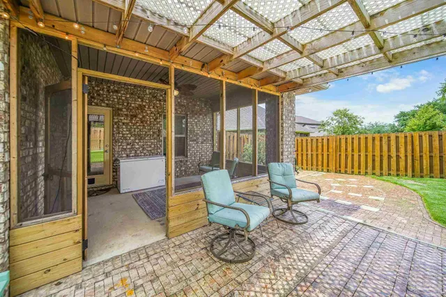 a view of a patio with a table and chairs and wooden floor
