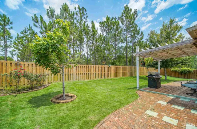 a view of a backyard with a garden