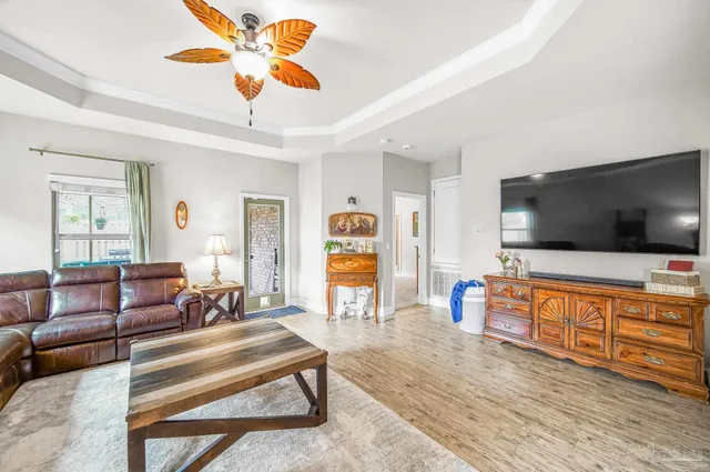 a living room with furniture and a flat screen tv