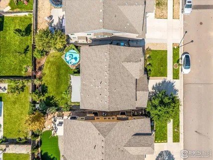 an aerial view of residential houses with outdoor space