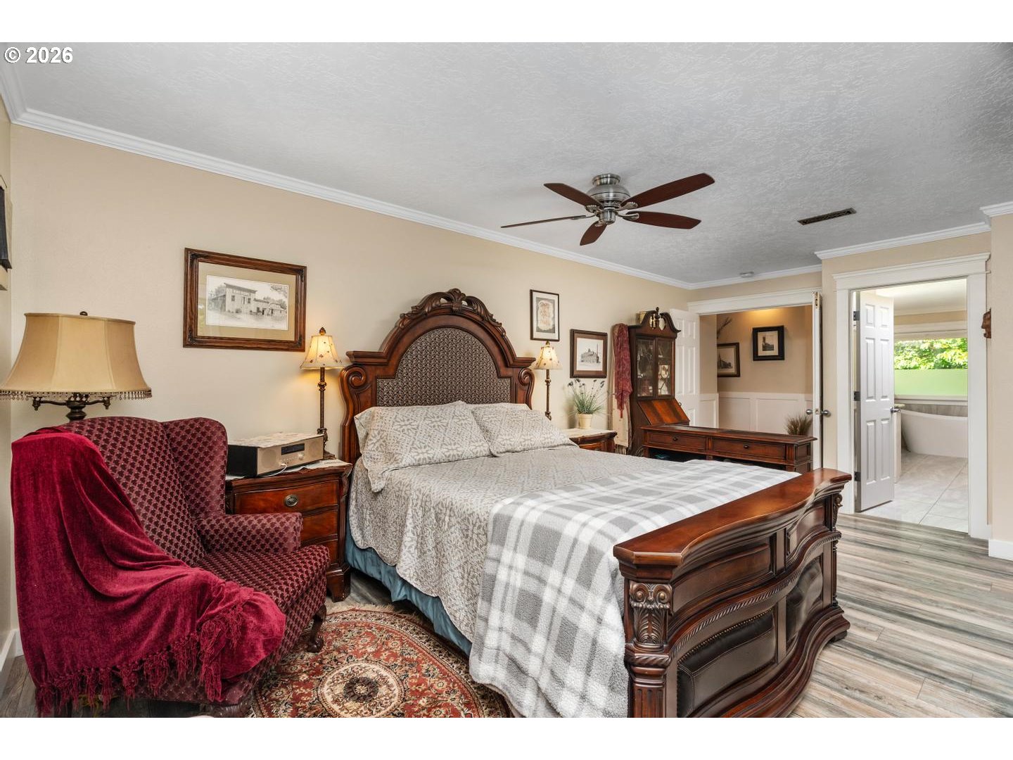 16042 Southwest Waxwing Way Beaverton, OR 97007 - Photo 23 of 48 a living room with furniture a ceiling fan and a rug