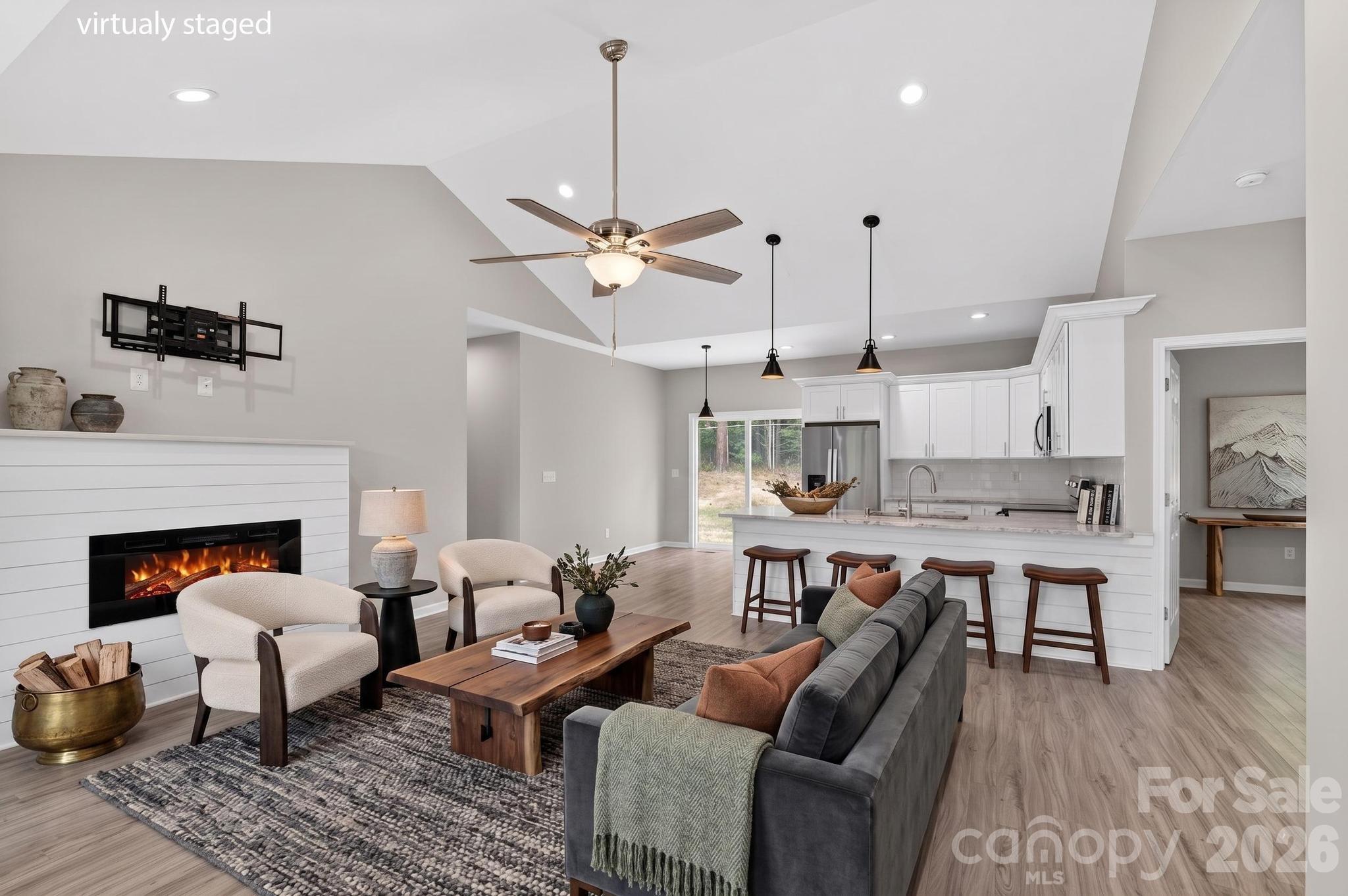 2119 South Road Morganton, NC 28655 - Photo 12 of 47 a living room with furniture a fireplace and a ceiling fan