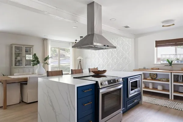 a kitchen with a stove and a sink