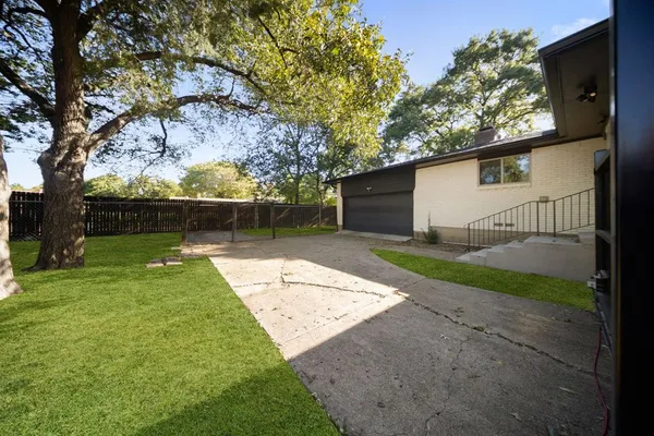 a backyard of a house with lots of green space