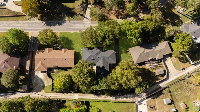 an aerial view of residential house with outdoor space and swimming pool