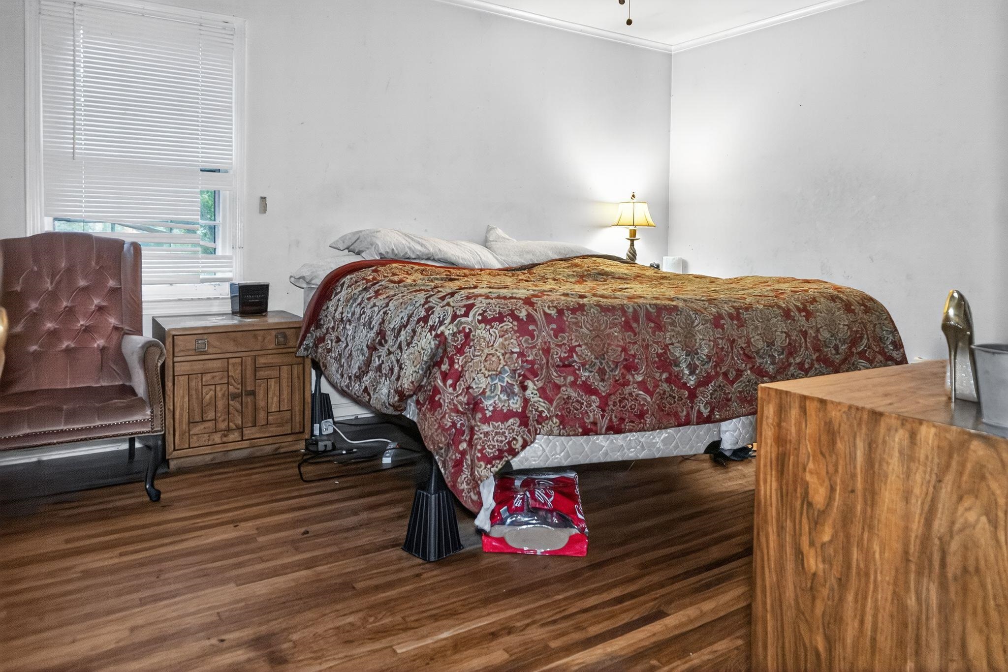 3034 Bannockburn Road Memphis, TN 38128 - Photo 11 of 18 a bedroom with bed and wooden floor