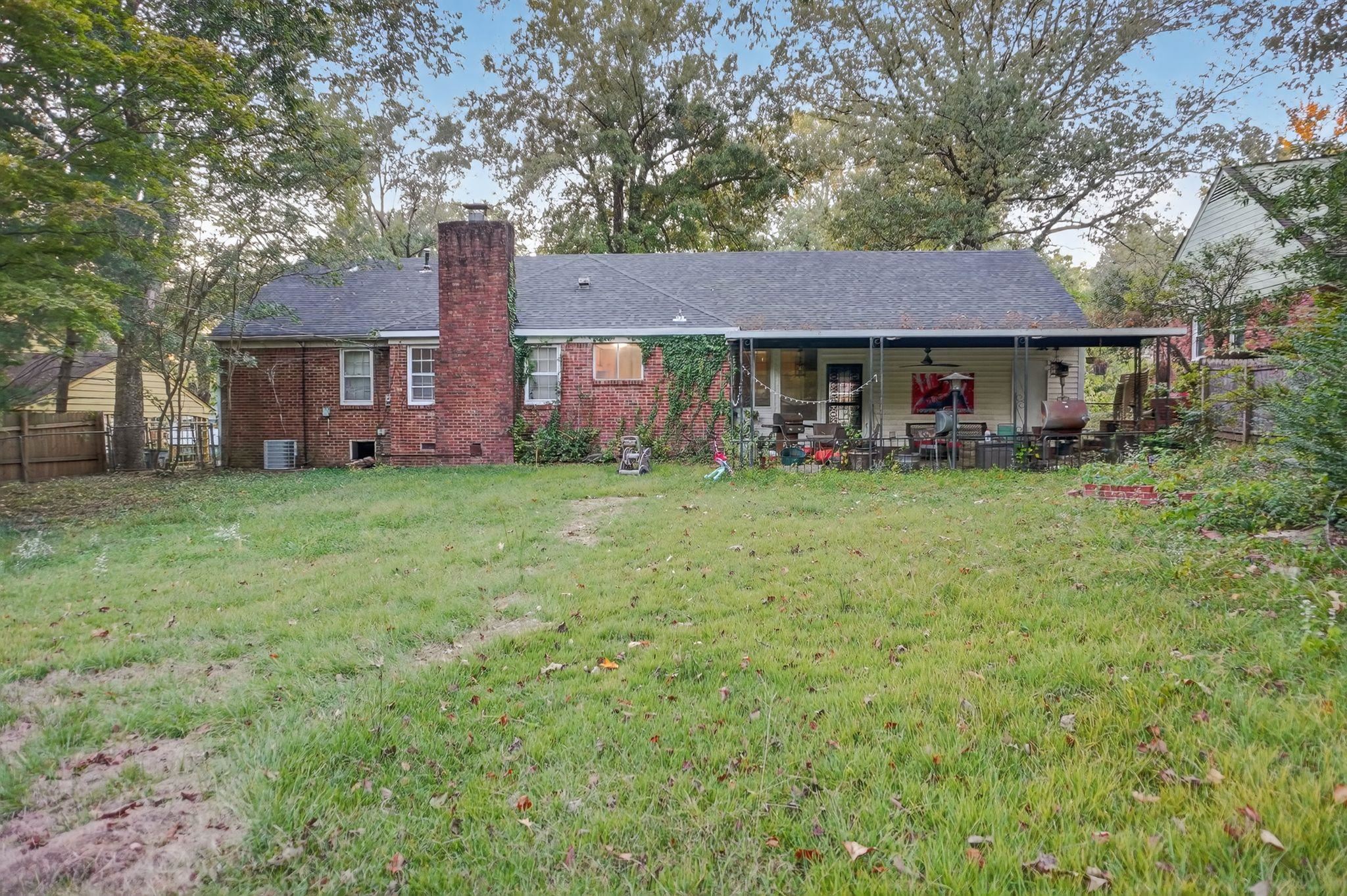 3034 Bannockburn Road Memphis, TN 38128 - Photo 17 of 18 a view of a house with a yard