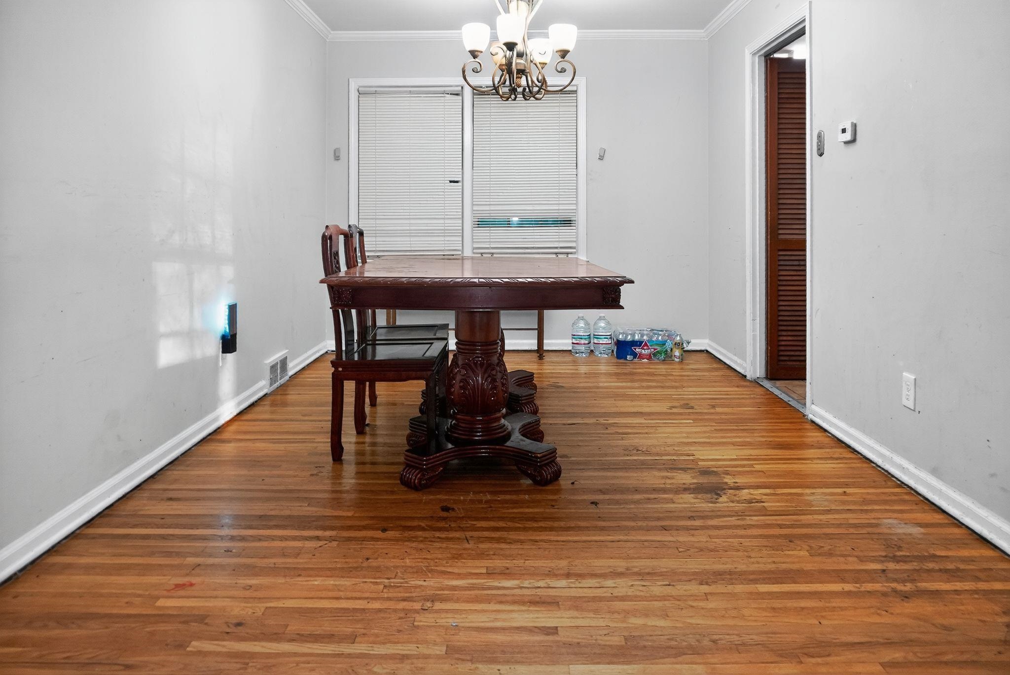 3034 Bannockburn Road Memphis, TN 38128 - Photo 10 of 18 a room with table chairs and wooden floor
