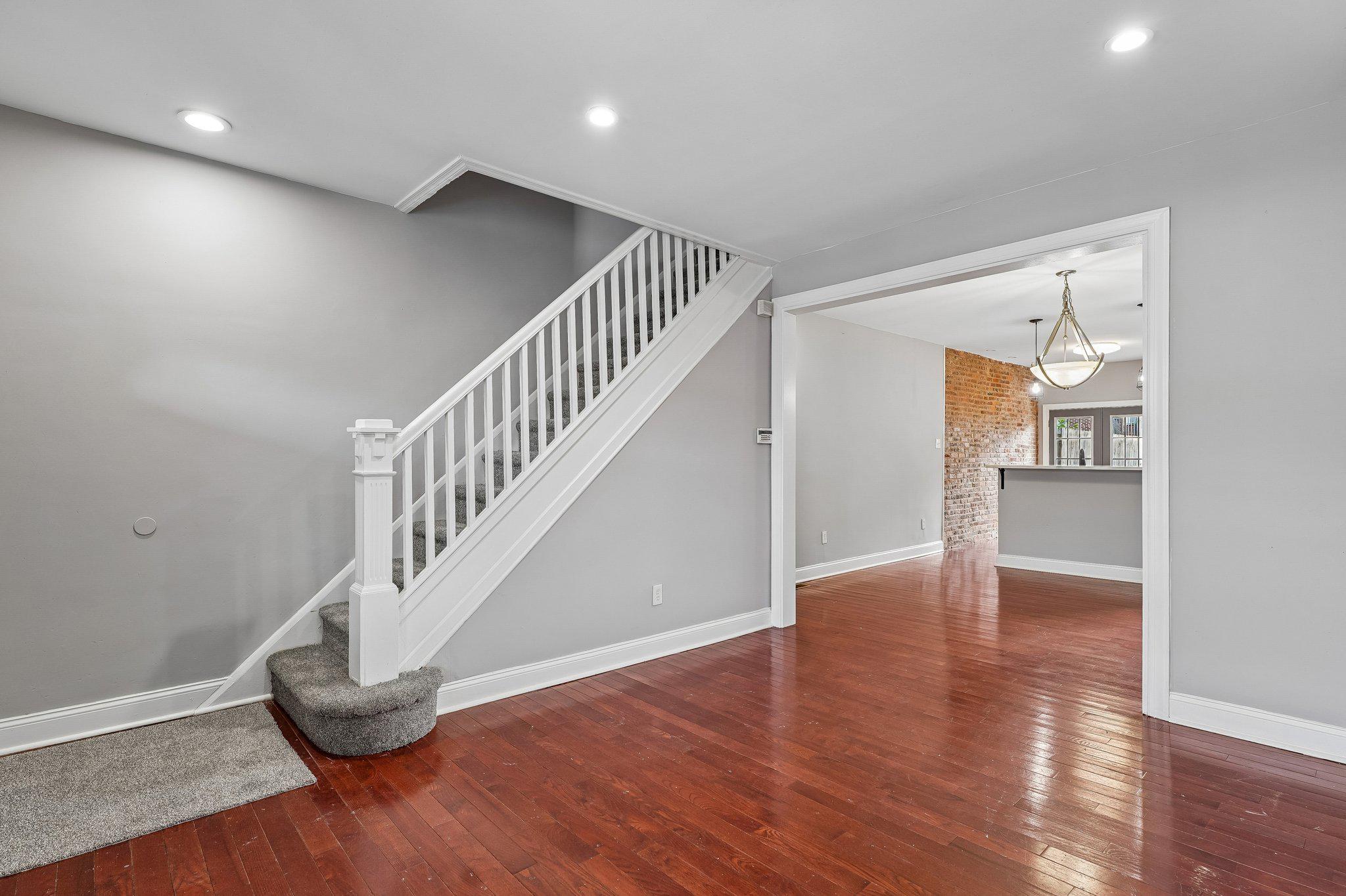 2817 Pelham Avenue Baltimore, MD 21213 - Photo 4 of 25 a view of entryway and hall with wooden floor