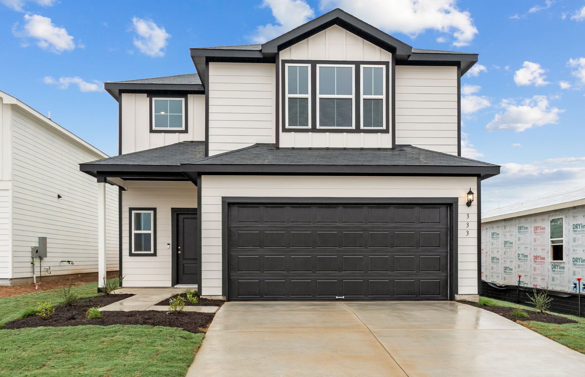 a front view of a house with a yard