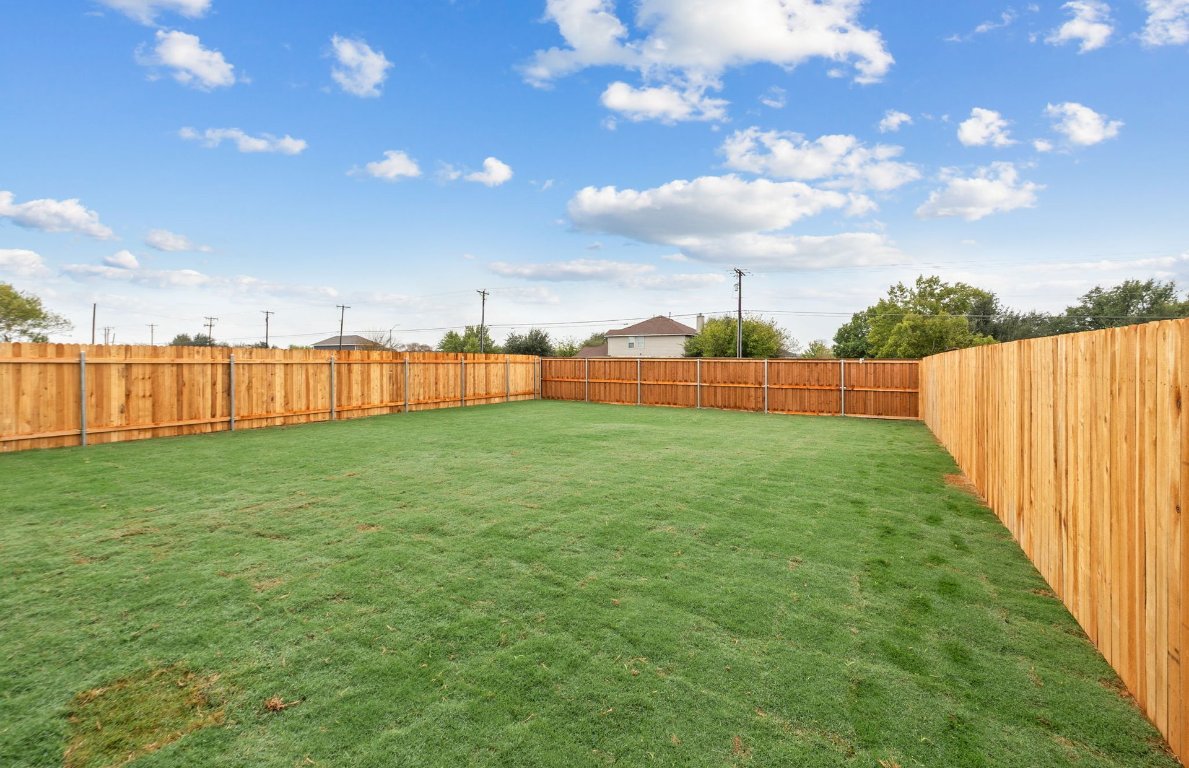 333 Sullivan Way Elgin, TX 78621 - Photo 16 of 18 a view of a backyard