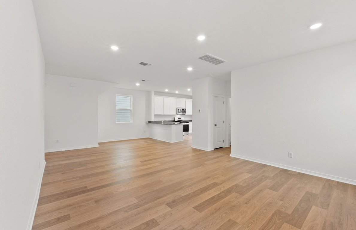 333 Sullivan Way Elgin, TX 78621 - Photo 6 of 18 a view of an empty room and kitchen view