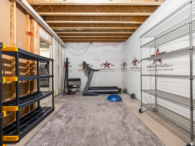 877 South Yarrow Drive Mapleton, UT 84664 - Photo 34 of 46 Unfinished basement area featuring exposed ceiling joists and wood wall framing
