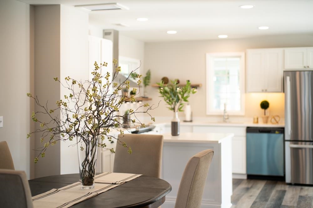 402 5th Street Shenandoah, VA 22849 - Photo 12 of 52 a vase of flowers sitting on a table near a window