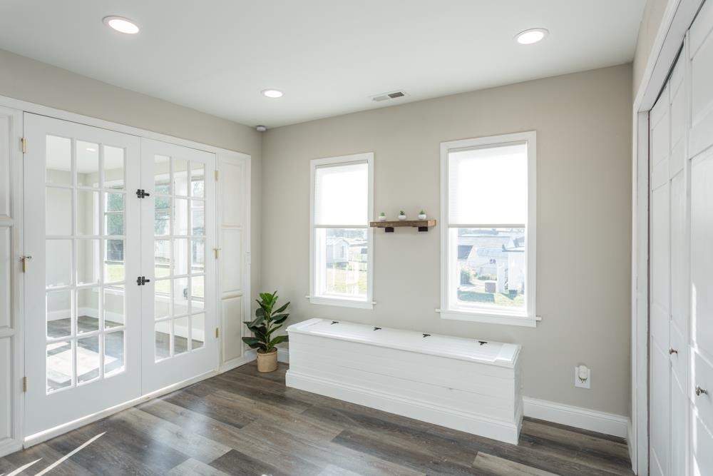 402 5th Street Shenandoah, VA 22849 - Photo 13 of 52 a view of an empty room with wooden floor and a window