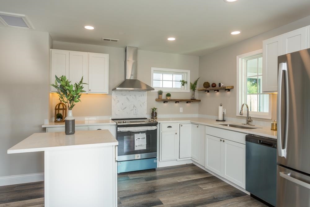 402 5th Street Shenandoah, VA 22849 - Photo 2 of 52 a kitchen with stainless steel appliances a sink stove and refrigerator