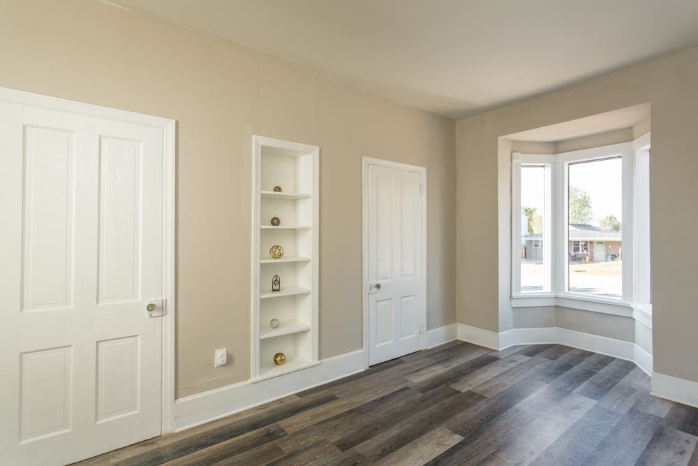 402 5th Street Shenandoah, VA 22849 - Photo 24 of 52 an empty room with wooden floor cabinet and windows
