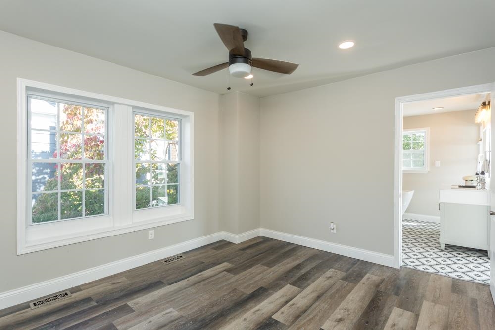 402 5th Street Shenandoah, VA 22849 - Photo 27 of 52 a view of an empty room with wooden floor and a window