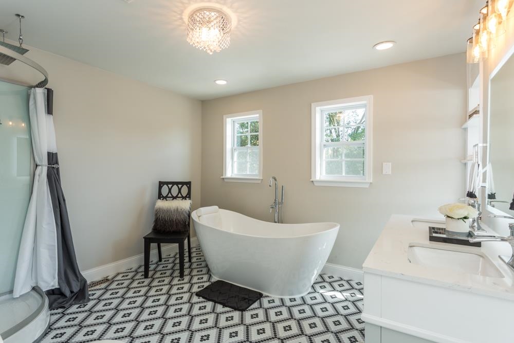 402 5th Street Shenandoah, VA 22849 - Photo 28 of 52 a spacious bathroom with a bathtub and window