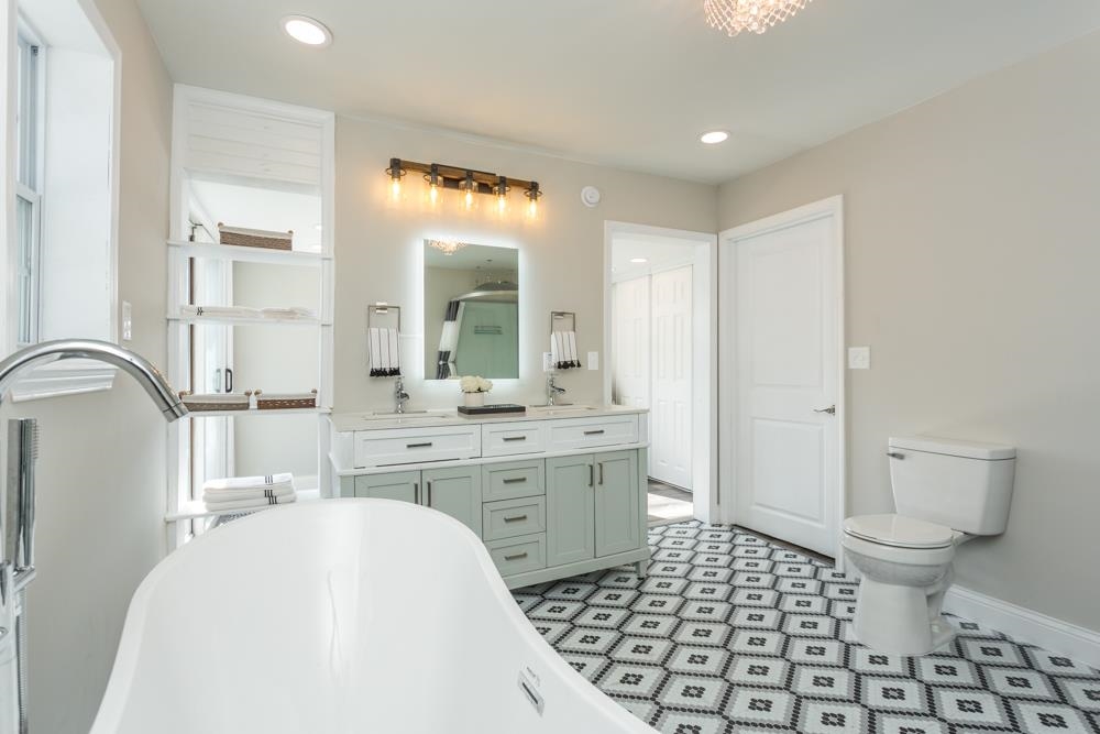 402 5th Street Shenandoah, VA 22849 - Photo 29 of 52 a spacious bathroom with a bathtub sink mirror and toilet