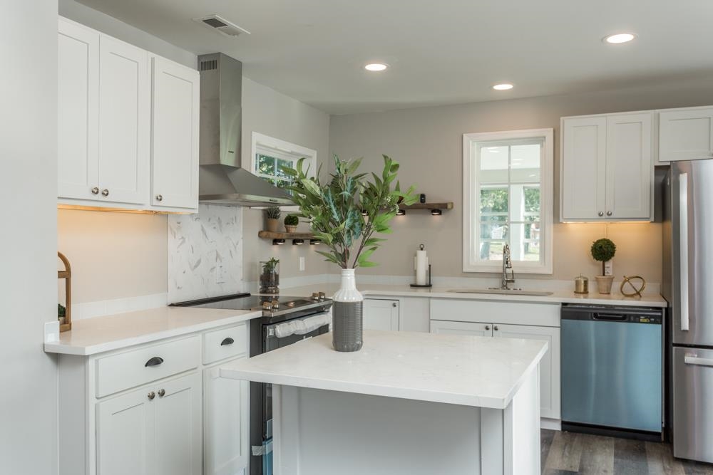402 5th Street Shenandoah, VA 22849 - Photo 3 of 52 a kitchen with a sink a window and cabinets