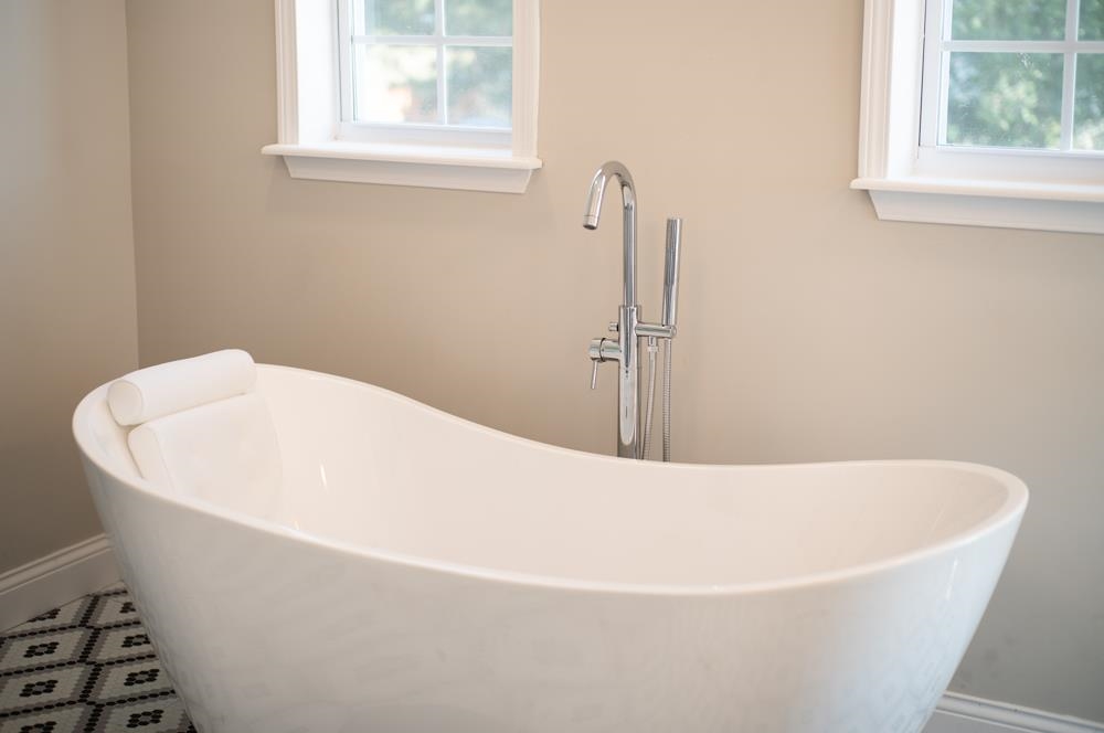 402 5th Street Shenandoah, VA 22849 - Photo 31 of 52 a white bath tub sitting in a bathroom