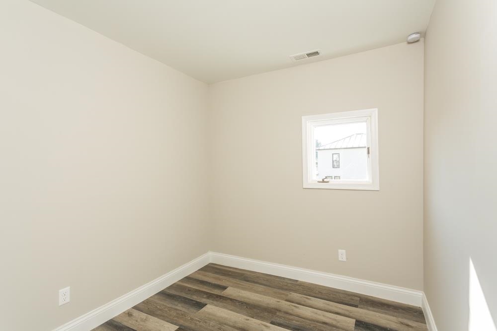 402 5th Street Shenandoah, VA 22849 - Photo 37 of 52 a view of a small space with wooden floor and a window