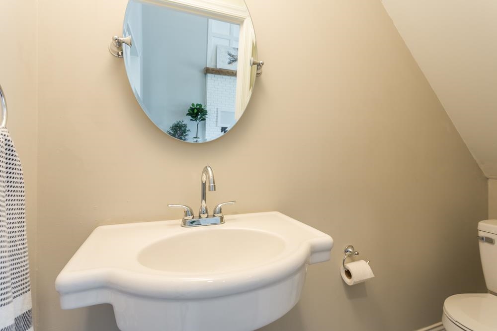 402 5th Street Shenandoah, VA 22849 - Photo 38 of 52 a bathroom with a sink and mirror