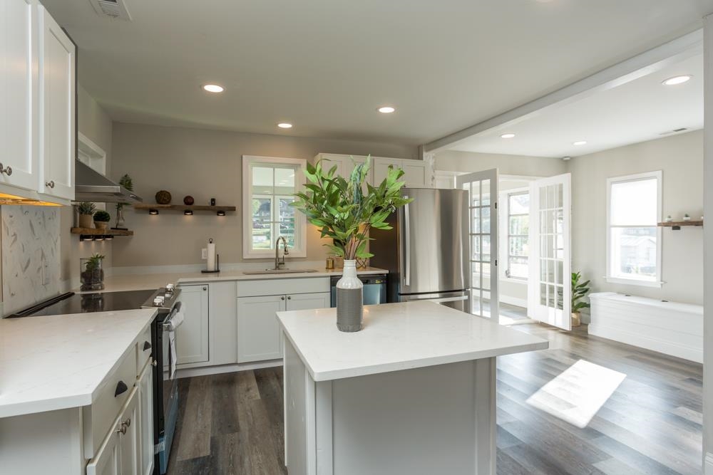 402 5th Street Shenandoah, VA 22849 - Photo 4 of 52 a kitchen with a sink a counter appliances and cabinets