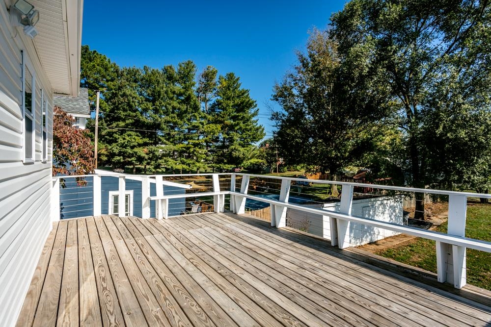 402 5th Street Shenandoah, VA 22849 - Photo 41 of 52 a view of a balcony with wooden floor and iron fence