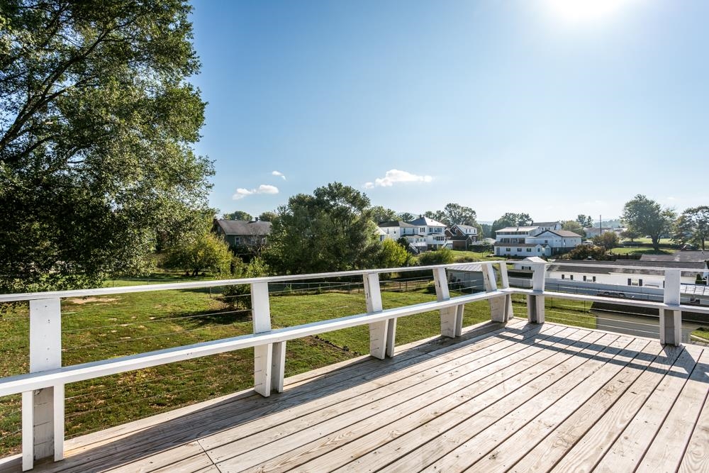 402 5th Street Shenandoah, VA 22849 - Photo 42 of 52 a view of a balcony with wooden floor and fence